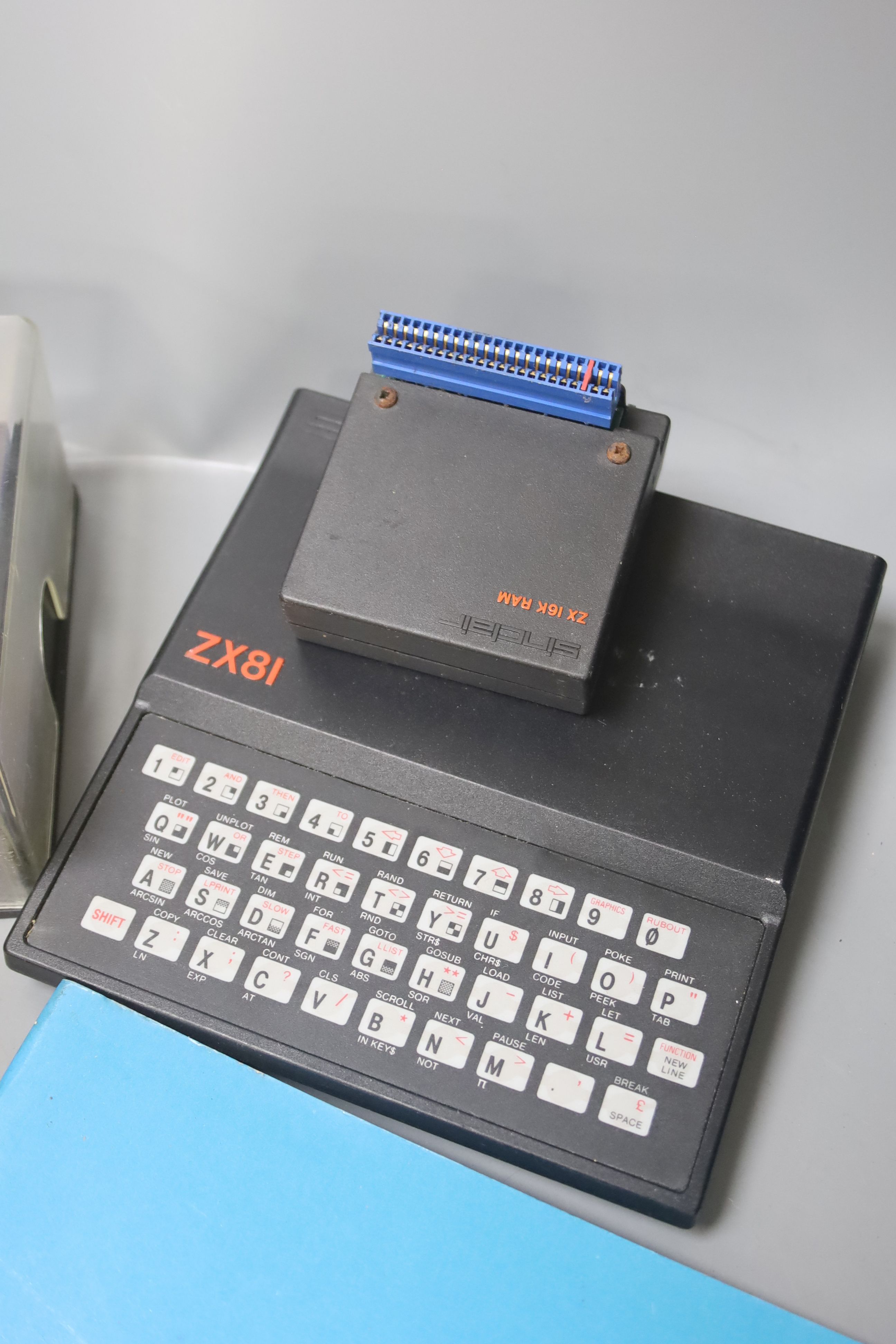 A Sinclair ZX81 personal computer, with tapes and instruction booklet